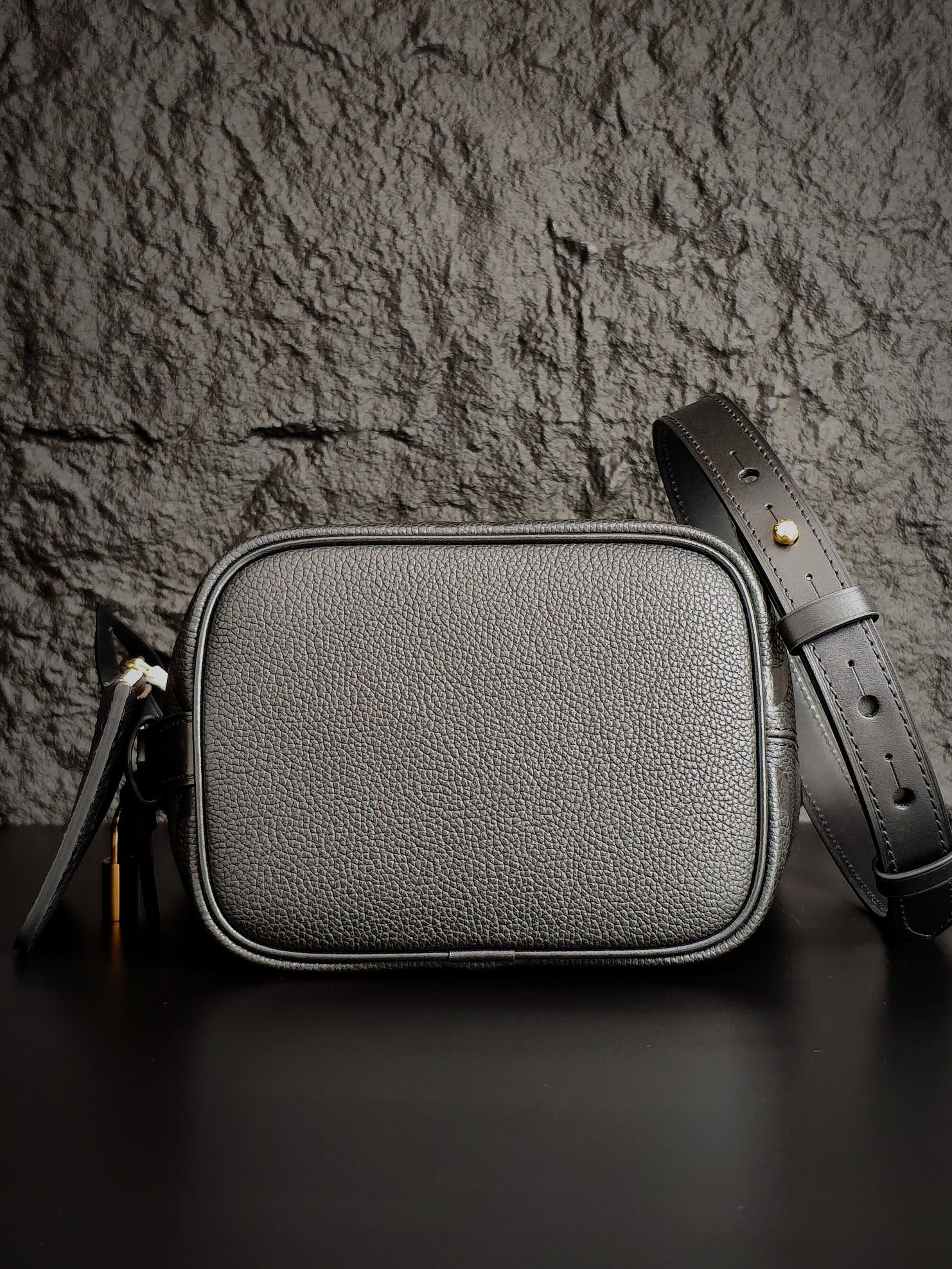 Louis Vuitton monogram crossbody bag in gray with rounded top and strap