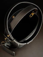Louis Vuitton monogram bucket bag strap with gold buckle hardware in gray