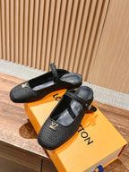 Louis Vuitton unisex black textured flats with T-strap and gold buckle, pair on box