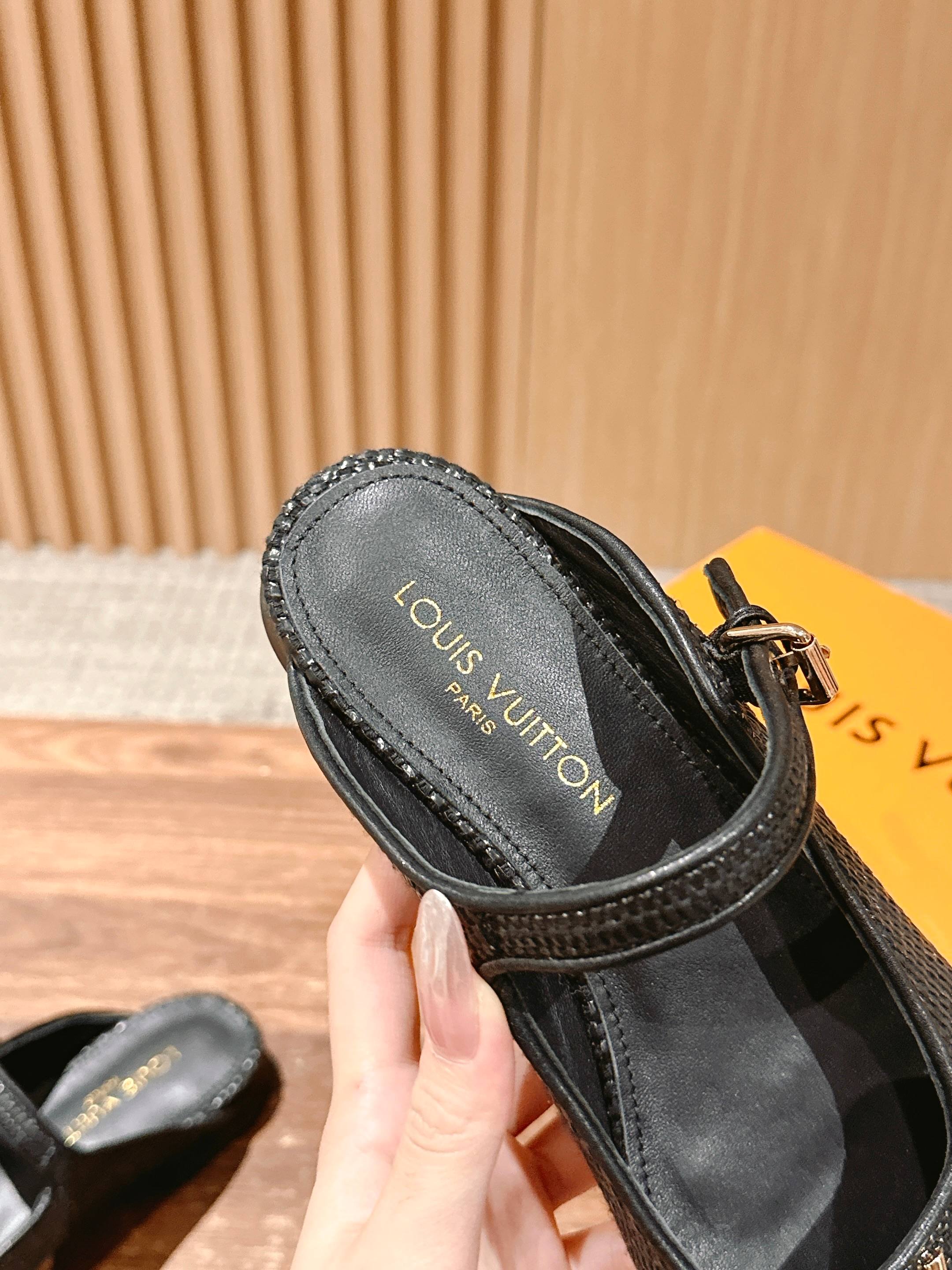 Louis Vuitton unisex black slide flats with stitched edge and gold logo on insole
