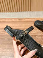Louis Vuitton unisex black textured flats with T-strap and gold buckle, top view