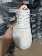 White leather lace-up sneakers with brown heel lining and AMIRI logo, gum sole
