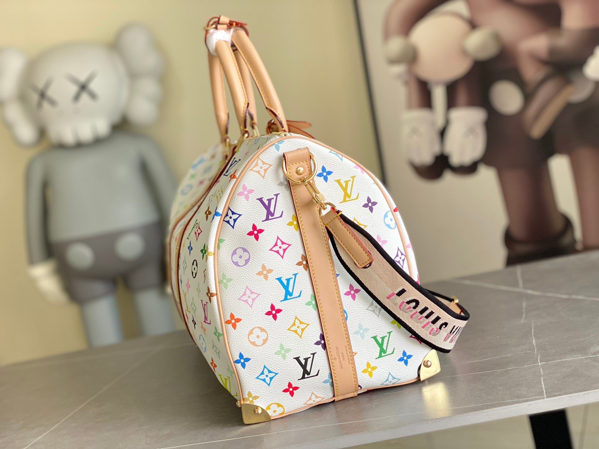 Men's Louis Vuitton duffel bag with round shape, multicolor monogram and tan trim