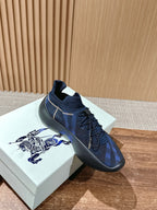 Burberry blue check knit sneaker with lace detail, dark side panel, and round toe sole
