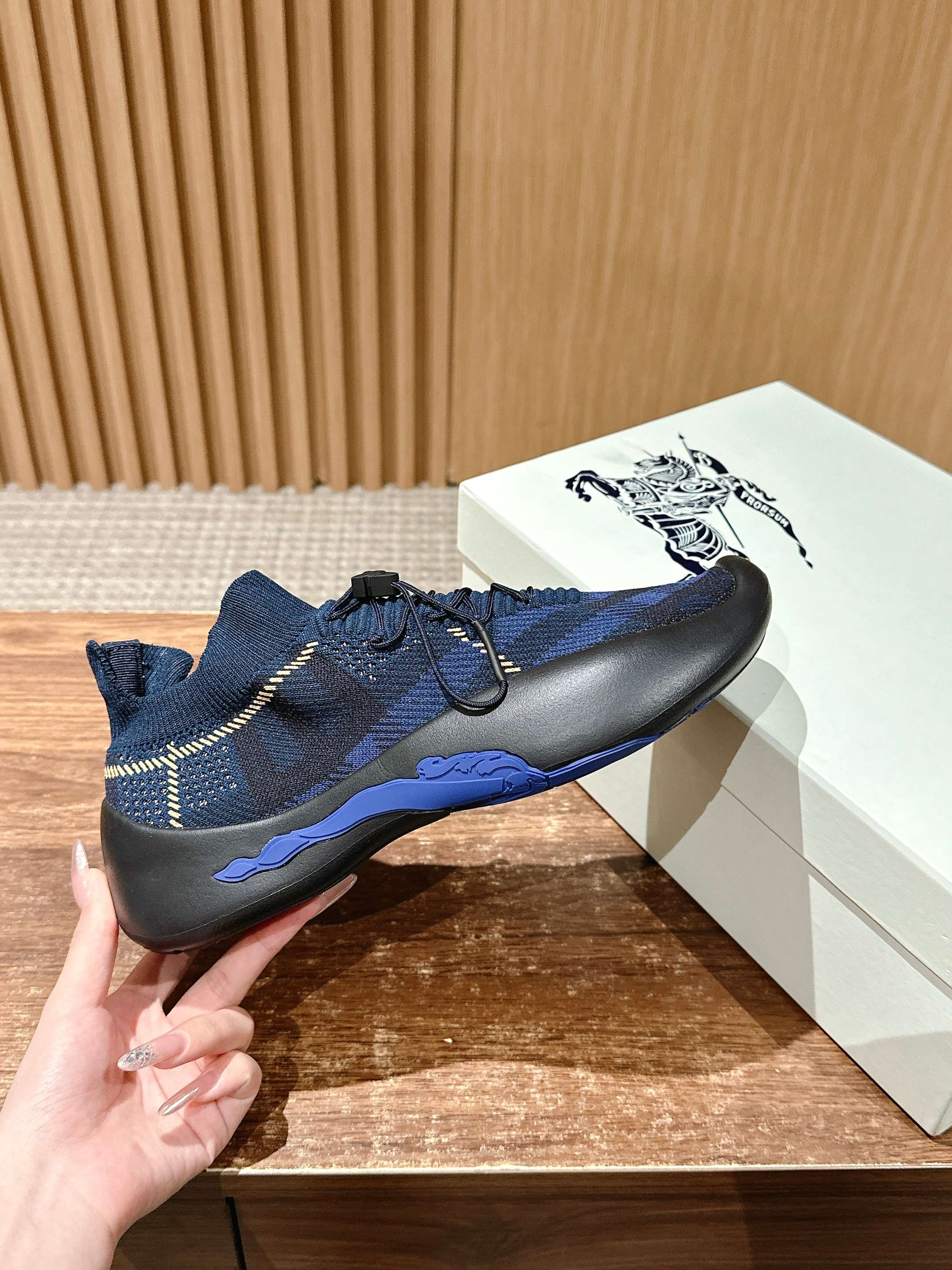 Burberry blue check sneaker side view with laces and black rubber sole