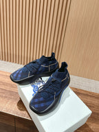 Burberry blue check sneakers with lace-up upper and accent trim along the outsole
