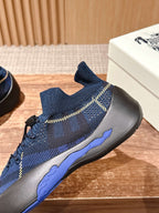 Burberry blue check knit sneaker with lace-up front, side seam stripes, and sole edge