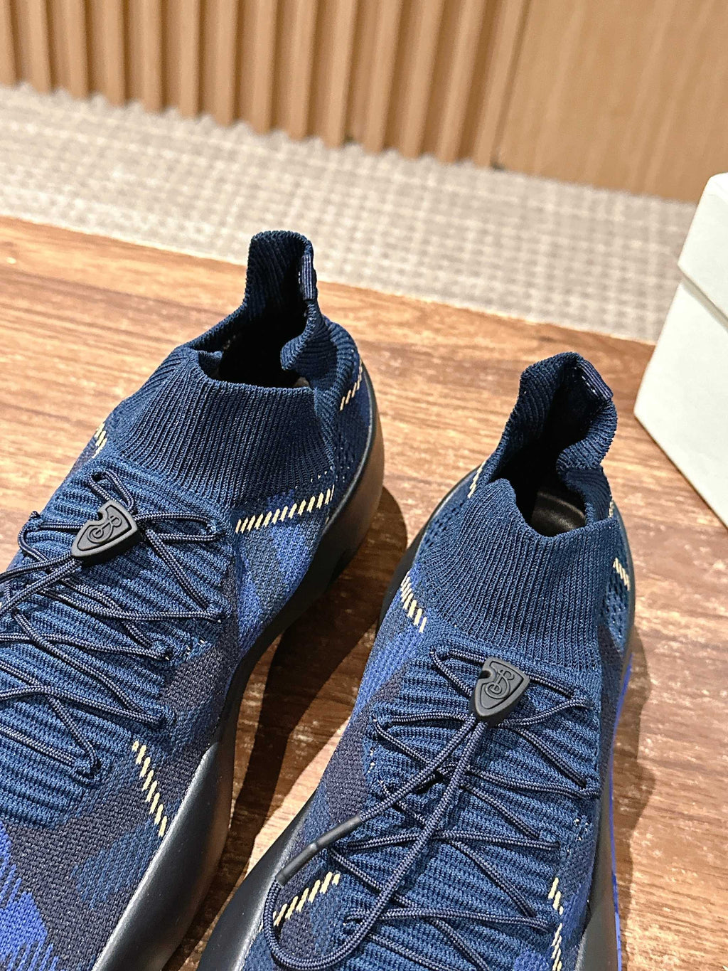 Burberry blue check knit sneakers with lace-up front and small shield-style side patch