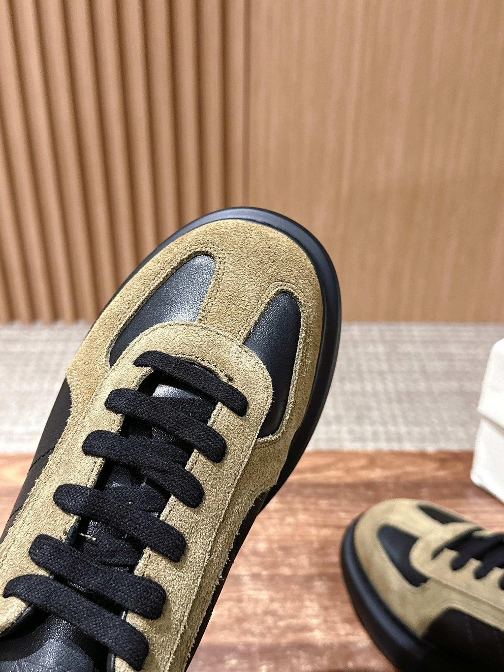 Alexander McQueen sneakers toe detail, tan suede with black laces and overlays