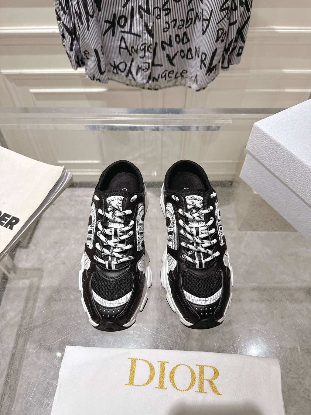 Pair of Dior black lace-up sneakers with white patterned laces