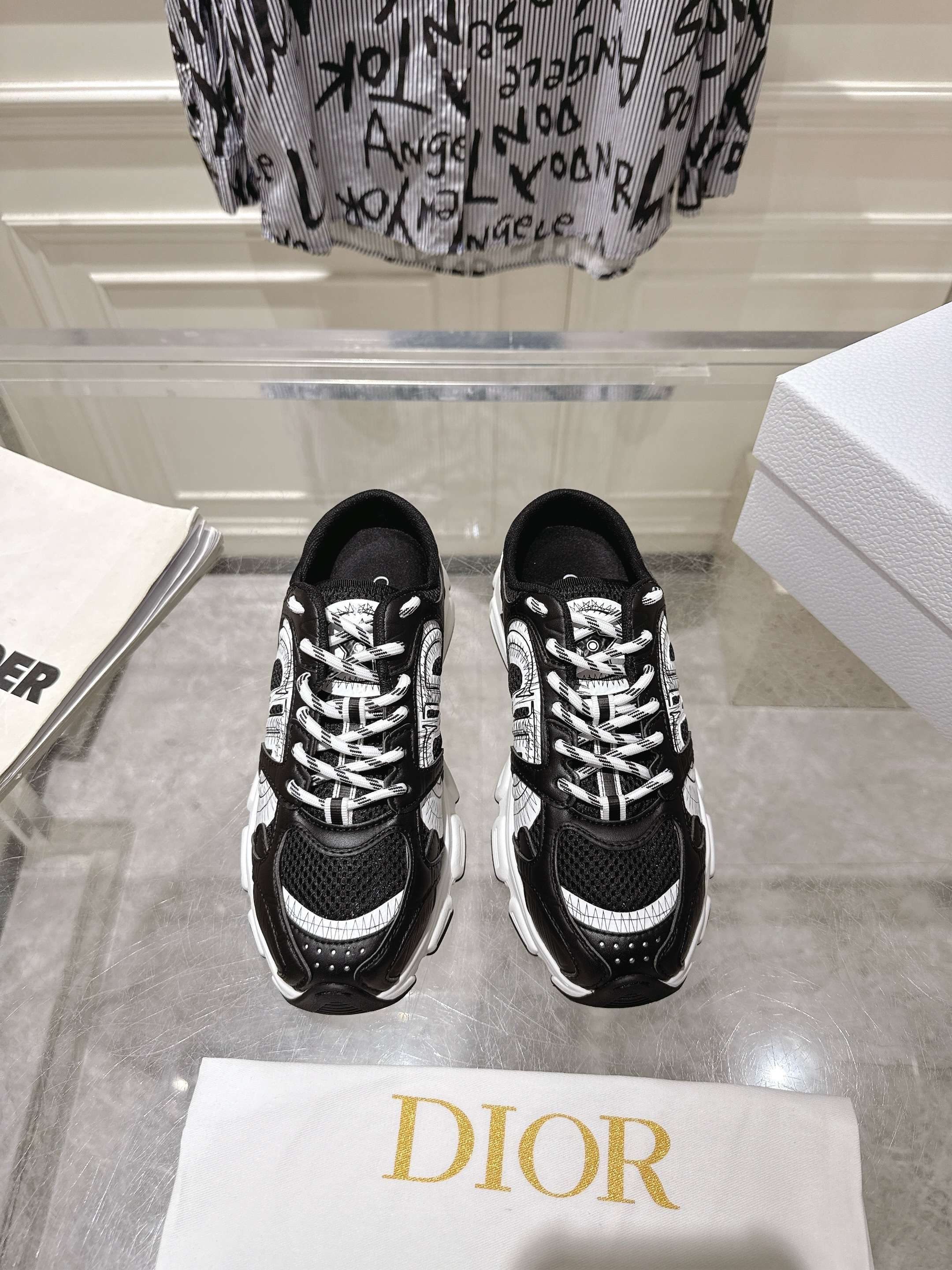 Pair of Dior black lace-up sneakers with white patterned laces
