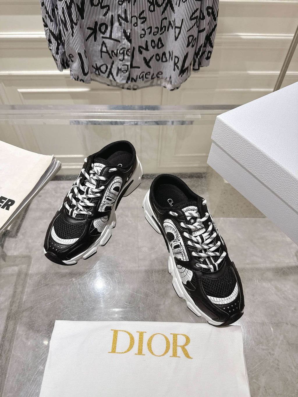 Dior black lace-up sneakers with white detailing and chunky sole