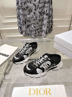 Dior black and white lace-up sneakers on display with chunky sole