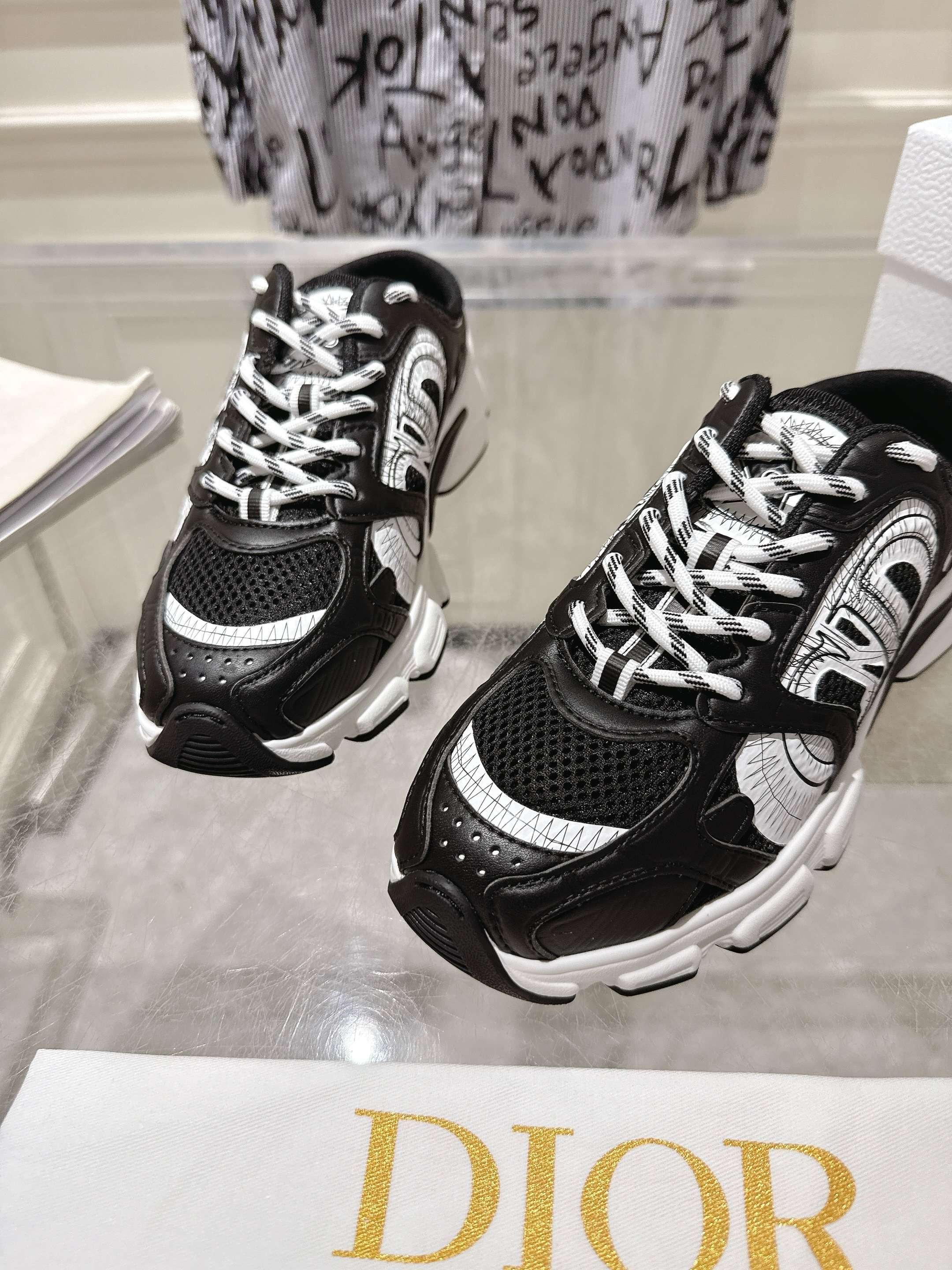 Dior black and white lace-up sneakers with thick tread sole