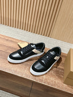 Black lace-up low sneakers with white sole and checkered side panel, angled view.