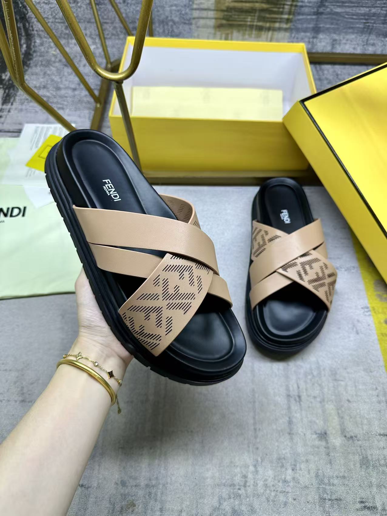 Beige Fendi sandals with FF-pattern straps and black slide sole