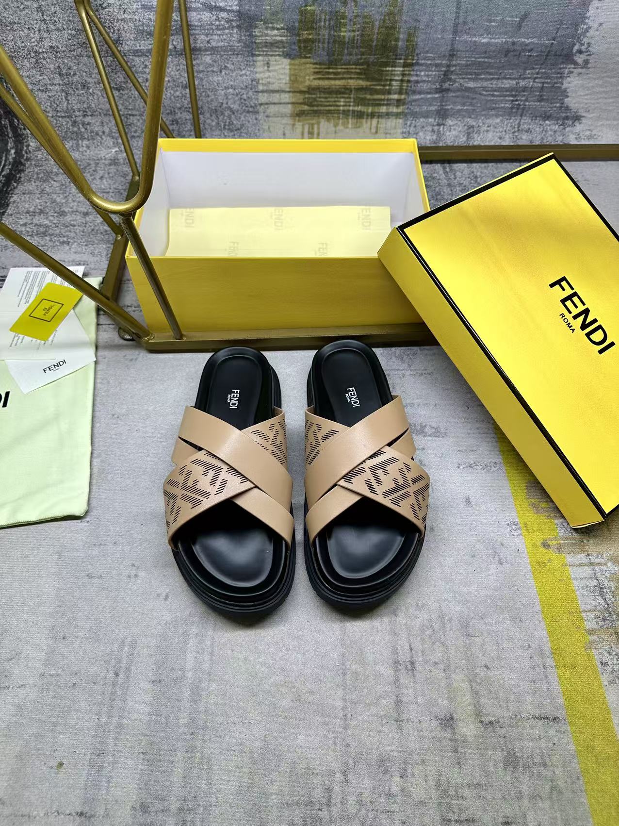 Fendi sandals with beige FF monogram straps and black padded footbed