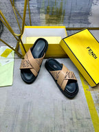 Pair of Fendi slide sandals with beige FF straps over black sole