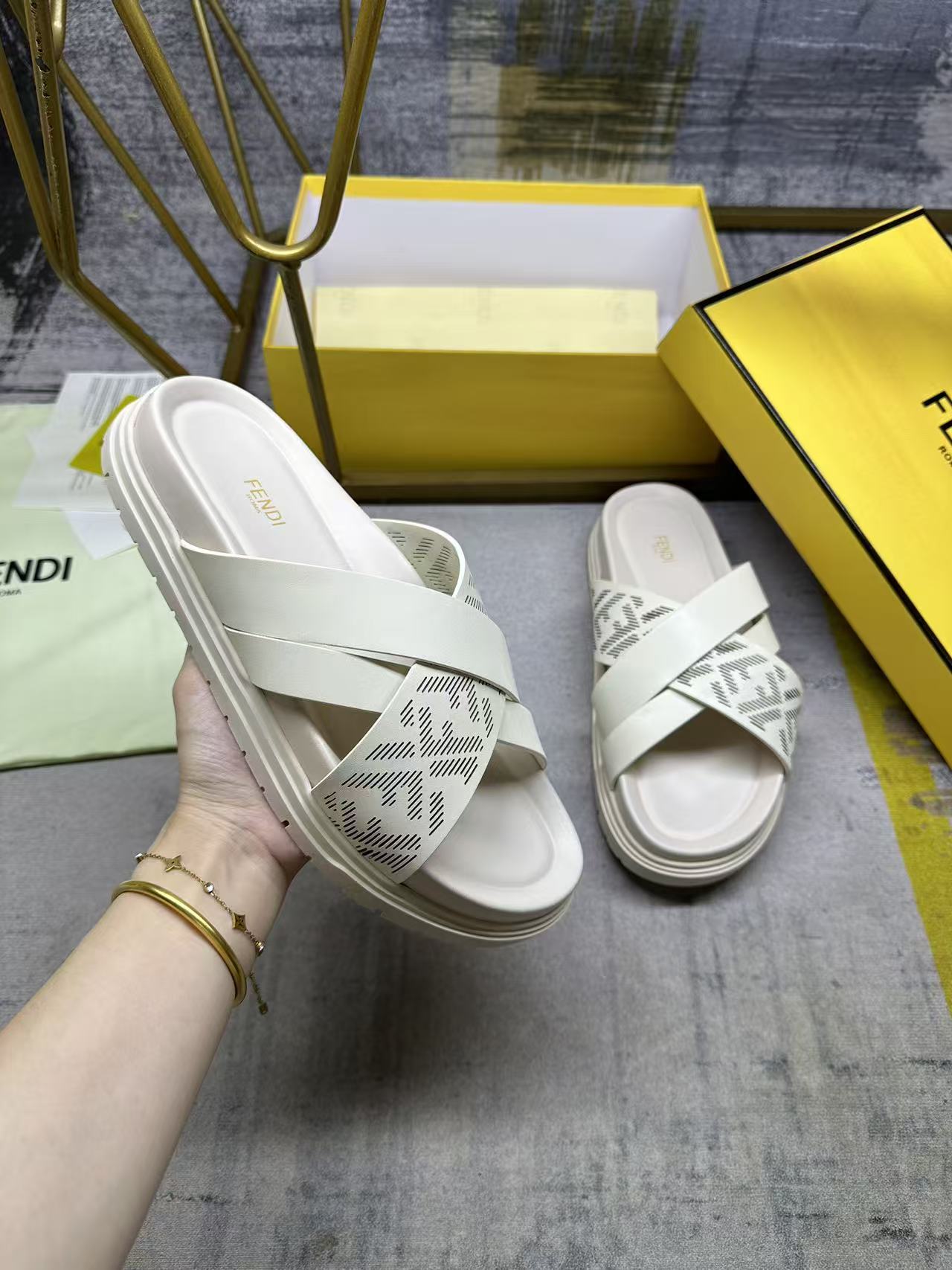 Fendi white slide sandals with double straps and FF logo pattern