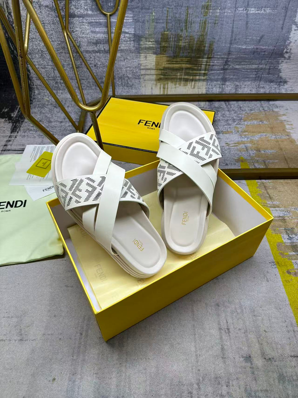 Fendi white slide sandals, angled view, double strap with FF logo pattern