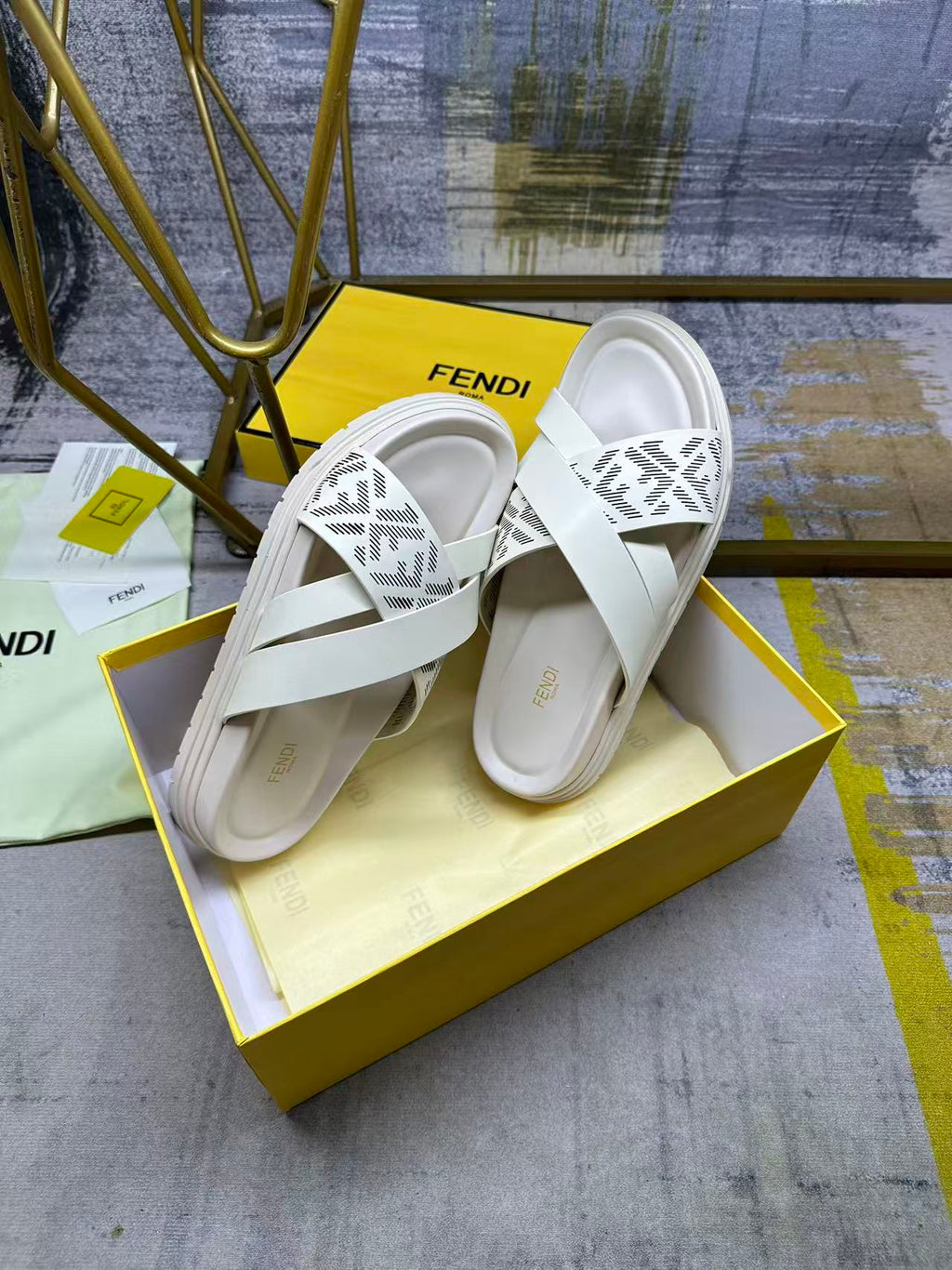 Fendi white slide sandals, top view of straps with FF pattern