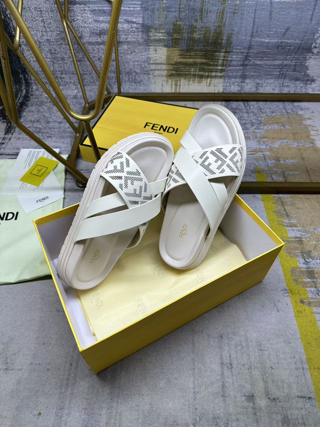 Fendi white slide sandals, top view of straps with FF pattern