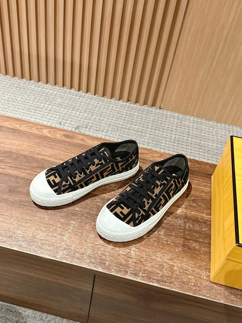 Pair of Fendi unisex sneakers, black FF logo upper with black laces and white soles