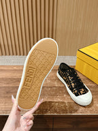 Fendi unisex sneaker outsole view, beige sole with FENDI text and black FF upper