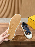 Navy FF monogram sneaker with white sole; outsole shown in beige with embossed tread