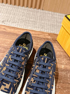 Two navy FF monogram sneakers showing tongue logo patch and blue lace-up front