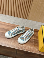 Fendi low-top sneakers, blue patterned upper with white laces and rubber sole
