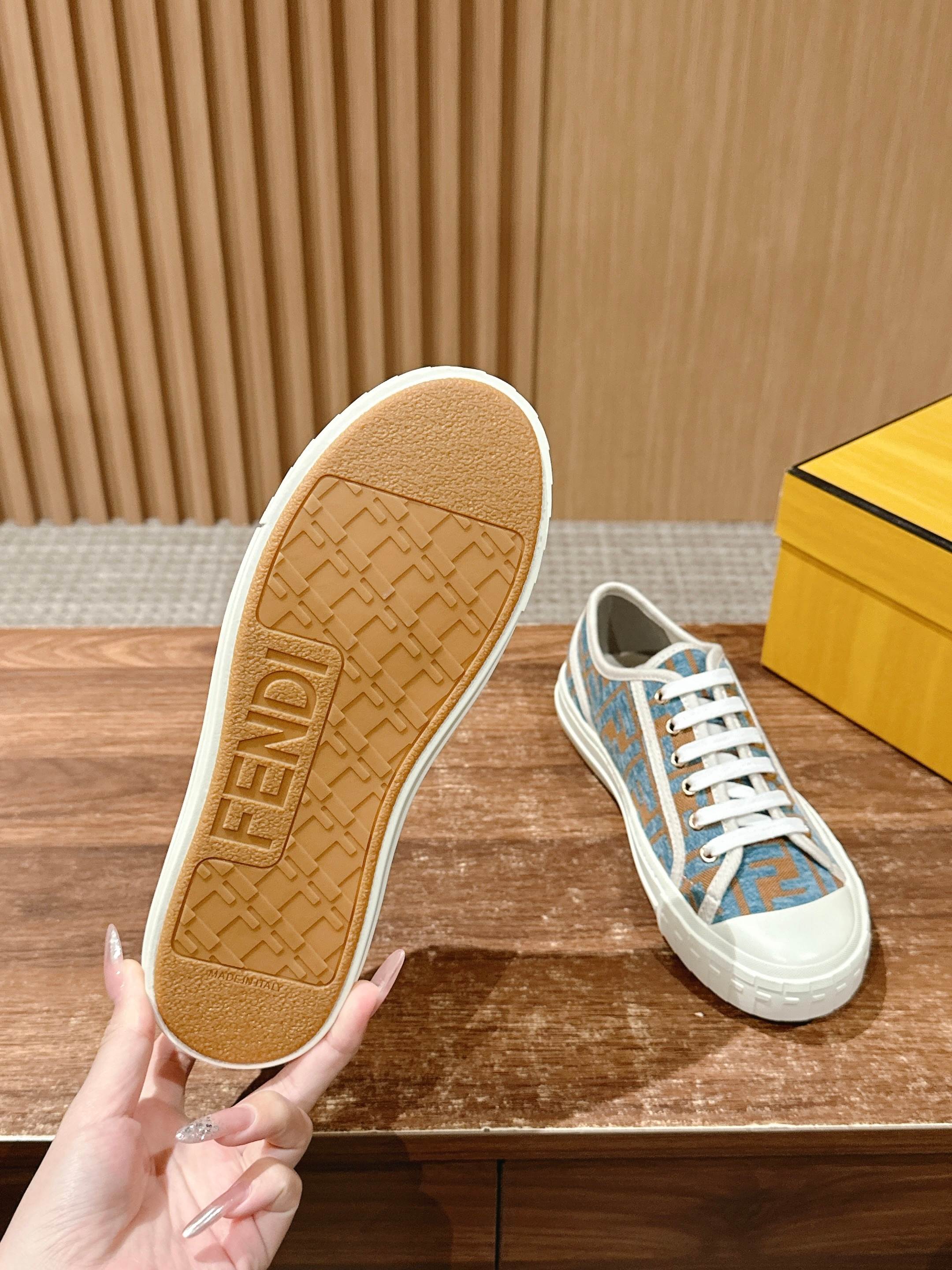 Fendi sneaker outsole and heel, tan tread with blue logo upper and white laces
