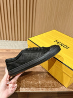 Fendi unisex black lace-up sneaker, side profile held in hand