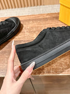 Fendi unisex black lace-up sneaker close-up, textured side panel