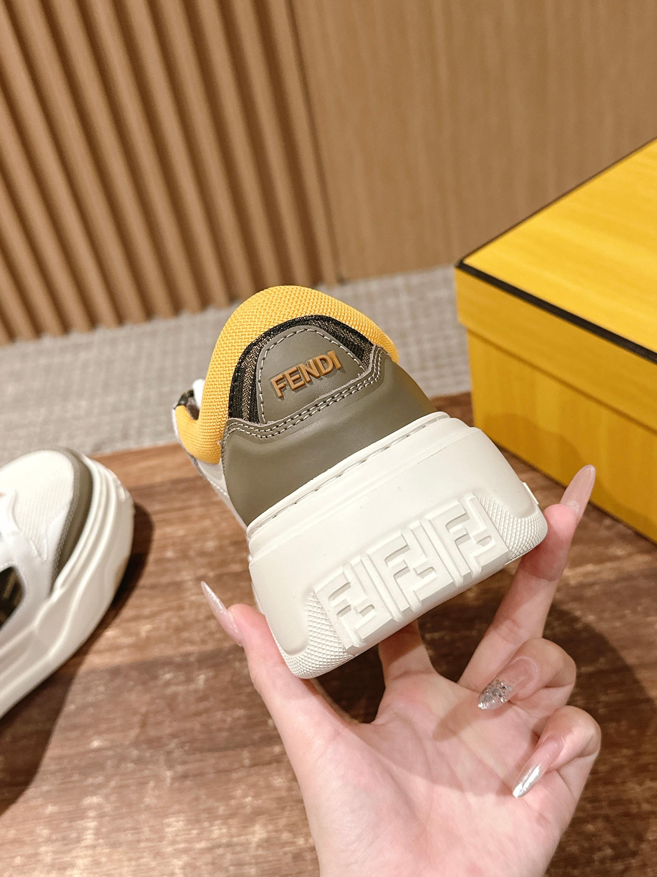 Fendi sneaker heel close-up with yellow sock lining and branded white platform sole