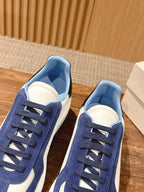 Alexander McQueen low-top sneakers from above: blue suede uppers and white toe panels