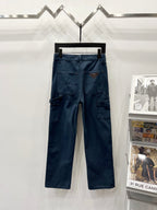Dark blue denim cargo pants with front patch pockets and stitched seams