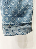Light blue monogram denim cuff with stitched hem and textured finish