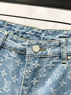 Light blue monogram denim waistband with button and zip fly detail