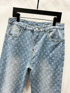 Light blue monogram denim jeans with front pockets and belt loops