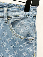 Light blue denim jeans pocket panel with monogram pattern and contrast stitching