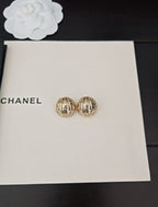 Round gold-tone stud earrings in gift box, two side by side