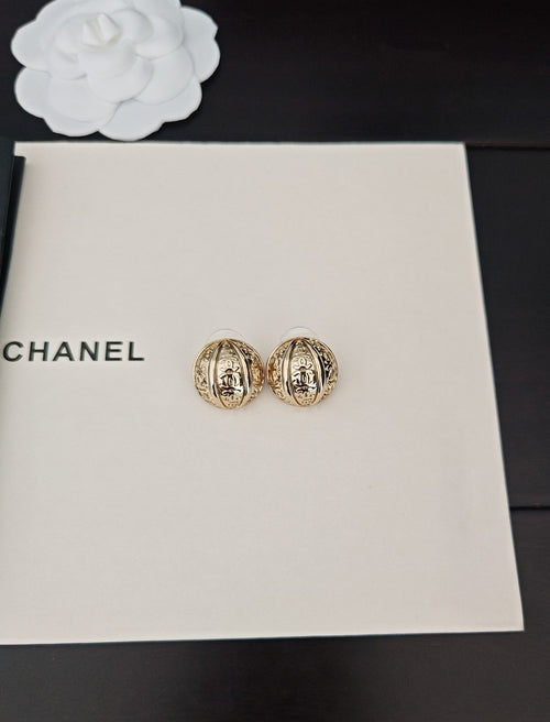 Round gold-tone stud earrings in gift box, two side by side