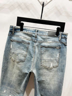 Light blue denim jeans back view with stitched pockets and subtle distressing