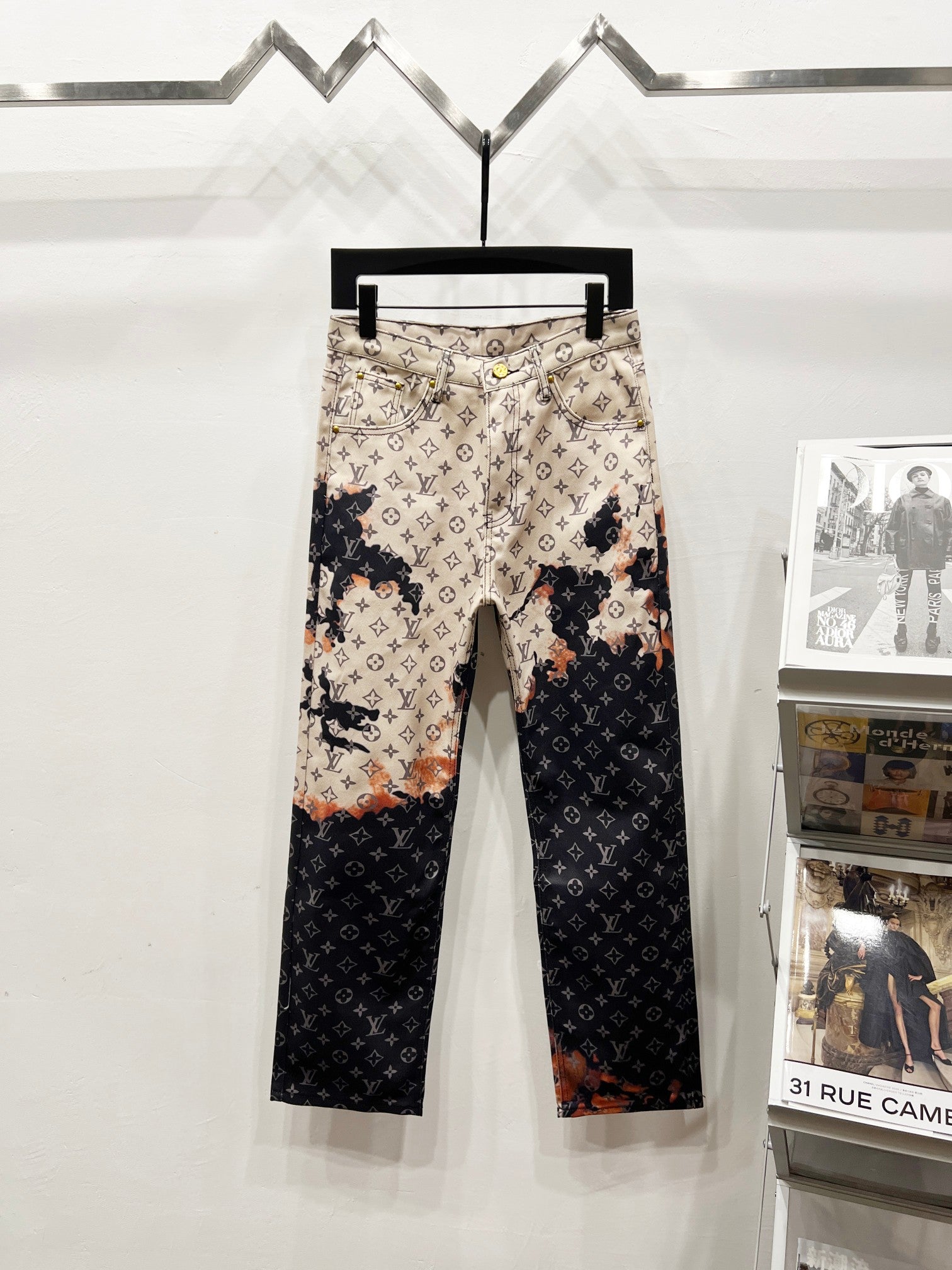 Two-tone monogram print trousers in beige and dark with belt loops and front seams