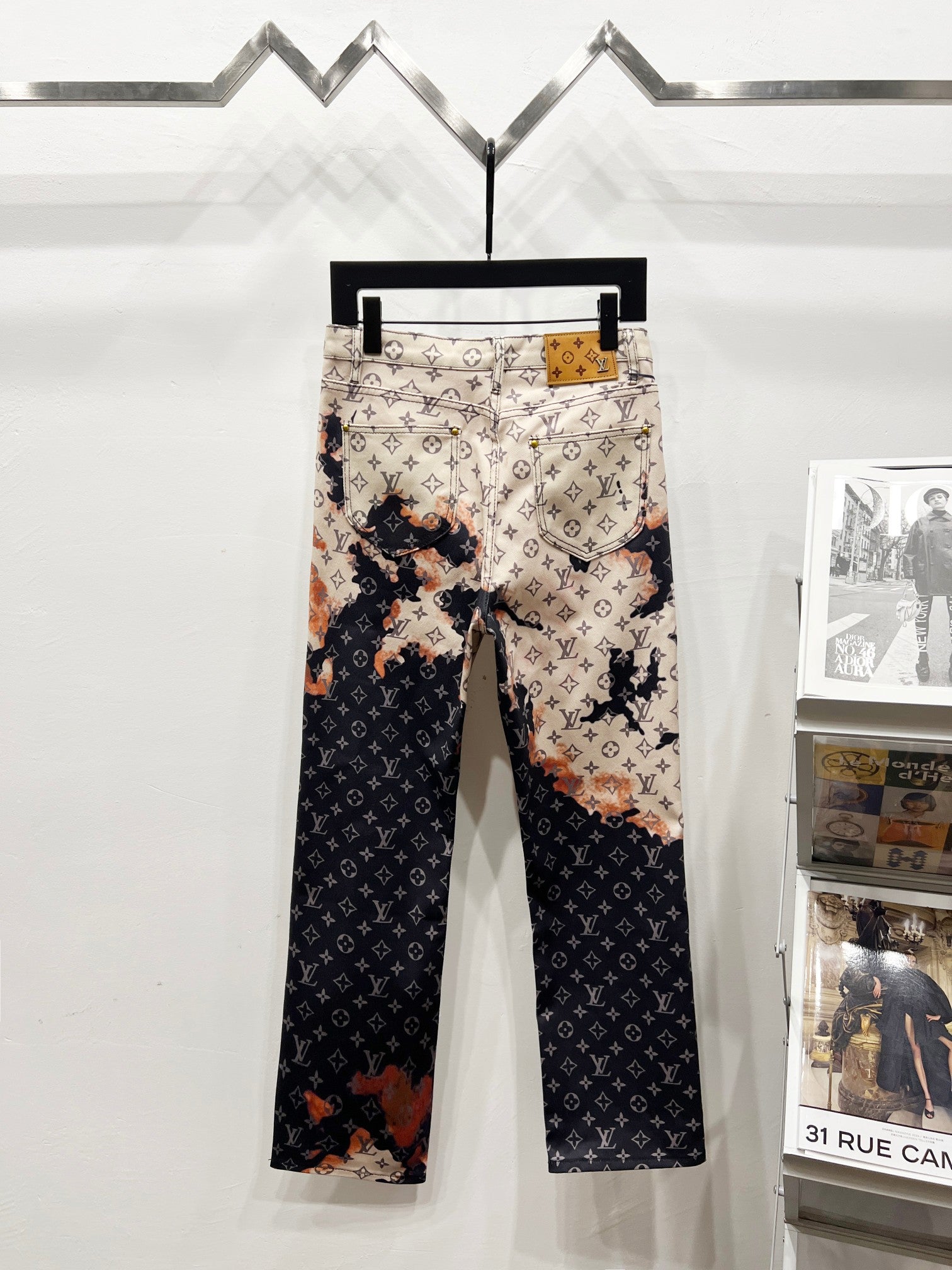 Two-tone monogram print trousers in beige and dark with belt loops and straight legs