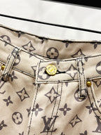Waistband close-up with monogram pattern fabric and buttoned interior label