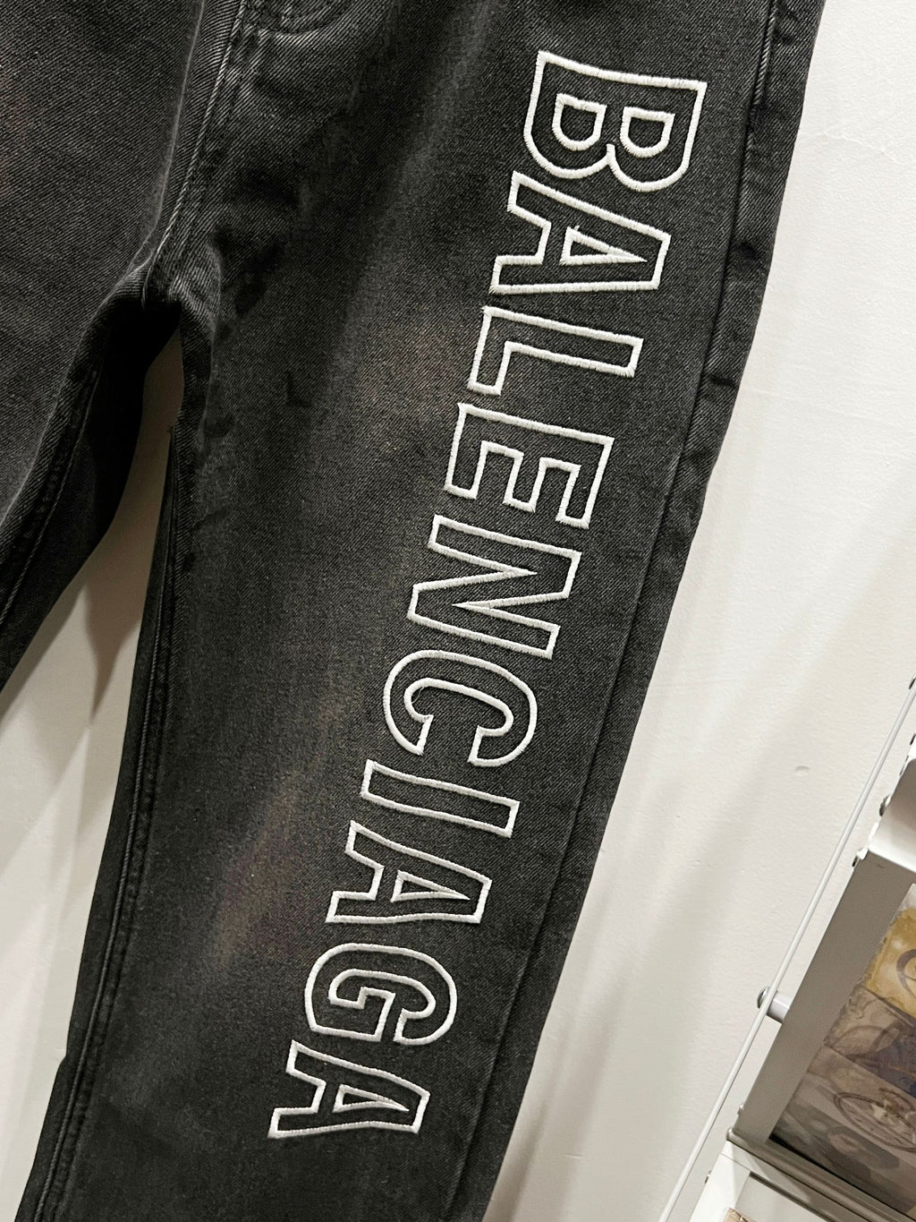 Dark denim pant leg with large Balenciaga logo print