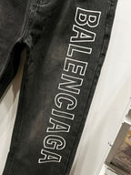 Dark denim pant leg with large Balenciaga logo print