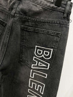 Dark denim back pocket detail with Balenciaga logo patch print